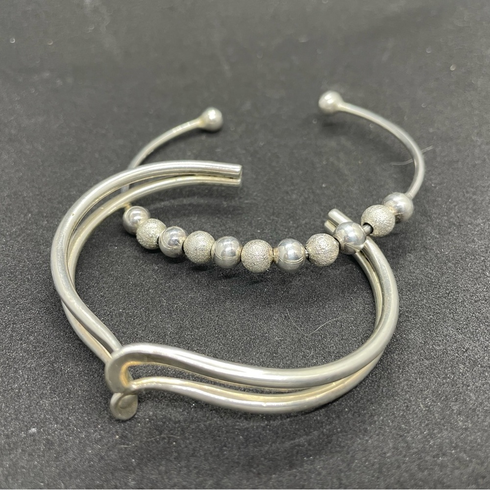 Two sterling silver bangle bracelet, beaded one is stamped 925